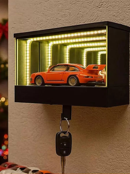 Key holder with orange car display and LED lights on a wall.